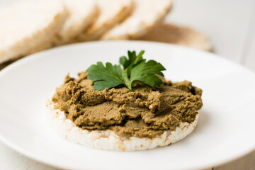 Healthy food, crispy rice cakes and beef liver pate on a light background