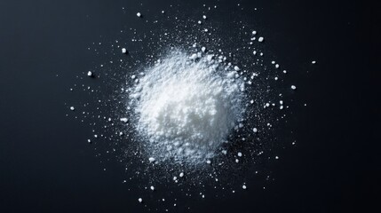 pile of white powder on black surface