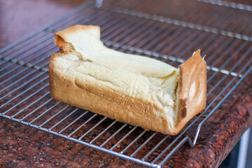 broken, flat, half-cooked white bread