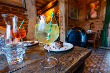 cocktail and chocolate cake on table in restaurant