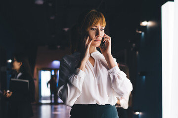 Frustrated manager calling on smartphone at office space