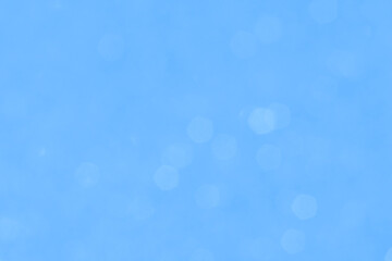 Magic blurred background in soft blue shades with bokeh effect. Ideal for design, christmas backgrounds and creative projects.