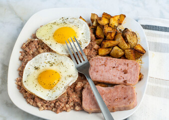 fried eggs with spam and hash browns