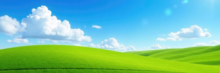 Fototapeta premium A bright blue sky with fluffy white clouds stretches above a rolling hills landscape, vast, fields