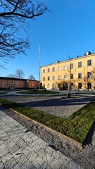 Naklejka premium The old charming yellow Ulfsunda Slott castle in Stockholm with historic architecture and interior design