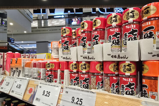 Penang, Malaysia - Feb 22, 2025: Close-up of S&B Nanami Togarashi Japanese spice bottles displayed on a supermarket shelf at AEON Grocery.