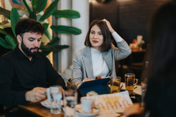 Colleagues engage in a casual meeting at a cafe, brainstorming and discussing together. The atmosphere is welcoming and collaborative, illustrating teamwork and professional interaction in a relaxed