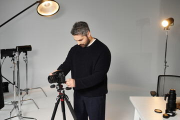 Creative professional sets up equipment in a modern studio for an artistic project