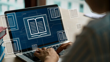 Person working on laptop with document icons overlay, library setting