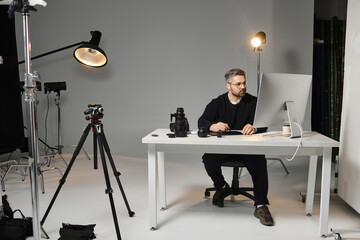 Creative professional mastering digital photography in a modern studio setting