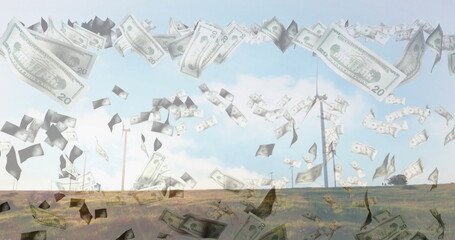 Falling money image over wind turbines in grassy landscape