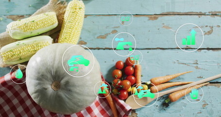 Fresh vegetables on wooden table with eco-friendly icons image