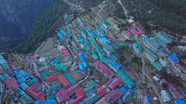 Namche Bazaar perching amid Himalayan mountains, providing essential acclimatization stop for mountaineers approaching Everest Base Camp trekking routes