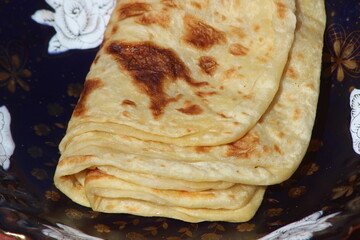 A close-up of the traditional Moroccan flatbread known as Msemmen or Msemen