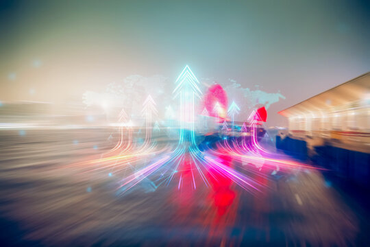 Hong Kong business concept of growing up with upward arrows.  A cityscape blurs beneath colorful streaks showing direction and future ideas.