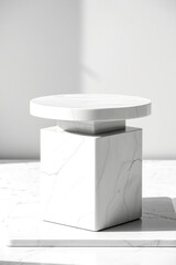 white marble display stand with circular top and base