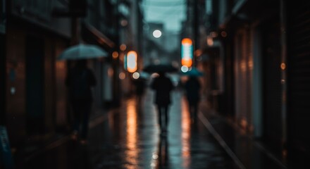 Fototapeta premium Blurred Alleyway at Dusk, People with Umbrellas Walking on Wet Pavement Reflecting Neon Lights under a Streetlamp