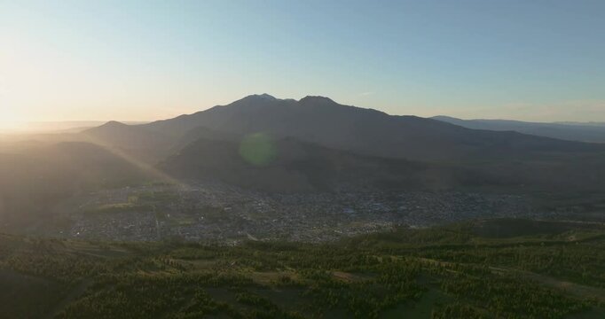 Stunning sunset aerial view of Esquel among mountain range in Patagonia, Argentina