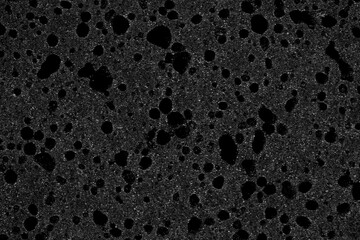 Close up of a black sponge, sponge background