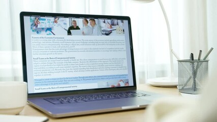 Online news site using laptop screen. People reading electronic newspaper on desktop. Mass media on digital platform.