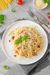Traditional Italian pasta Carbonara. Spaghetti with bacon, egg and parmesan cheese. Top view, copy space.