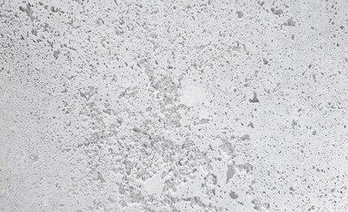 rough white raw concrete plaster with surface voids small holes texture grunge abstract background