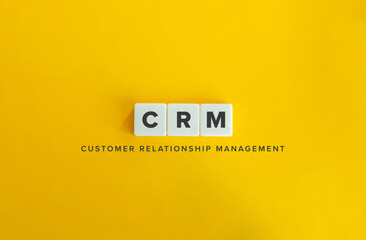 Customer Relationship Management, CRM. Block Letter Tiles on Flat Background. Minimalist Aesthetics.