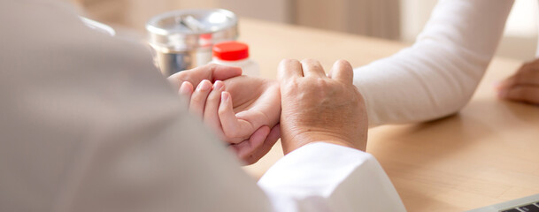 Senior woman doctor examining elderly while holding arm for pulse sitting in modern medical office, doctor checkup patient, patient and insurance, medical and health, doctor discussing with patient.