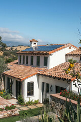 Clay tile roofing with solar panels seamlessly integrated into a classic Mediterranean-style design