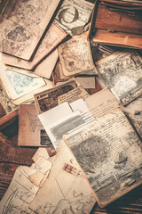 Illustration of a collection of vintage travel tickets and postcards, scattered on a rustic wooden table, evoking nostalgia for a bygone era. The sepia toned colors and intricate designs transport the