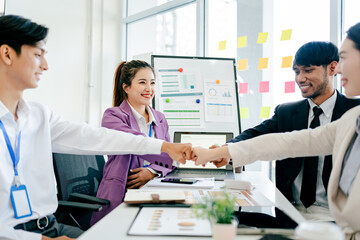 The concept of cooperation and teamwork of co-workers coworkers holding hands Successful agreement after excellent meeting The scene is professional and friendly.