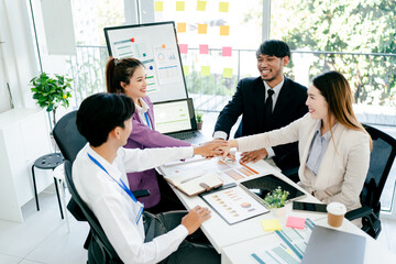 The concept of cooperation and teamwork of co-workers coworkers holding hands Successful agreement after excellent meeting The scene is professional and friendly.