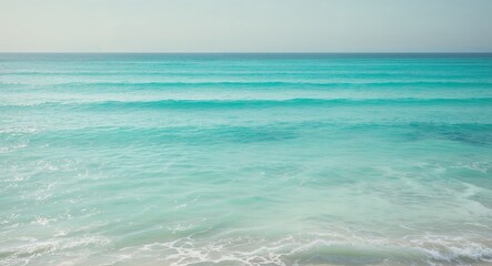 Obraz premium The ocean is blue and has a lot of water.