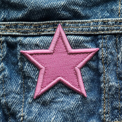 pink star patch on jeans texture background -
