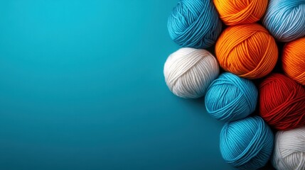 A colorful collection of yarn balls artfully arranged, showcasing vibrant hues that inspire creativity and warmth, ideal for crafting, knitting, and artistic expression.