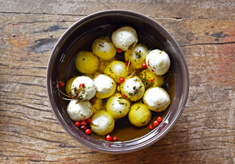 Bowl with goat cheese on the table