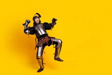 Humorous portrayal of a young man in knight's armor against a vibrant yellow backdrop
