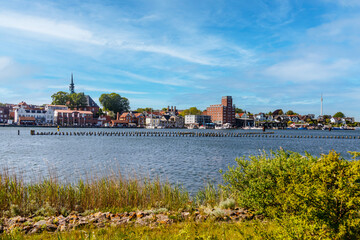 Kappeln skyline reflecting on river schlei in summer
