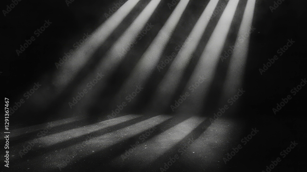 Poster dramatic grayscale light rays on dark grainy background for atmospheric design