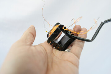 Disassembled Power Supply Transformer with Metal Parts and Wires