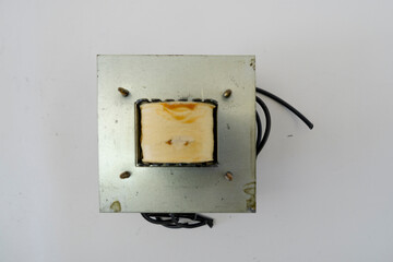 Disassembled Power Supply Transformer with Metal Parts and Wires