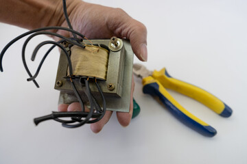 Disassembled Power Supply Transformer with Metal Parts and Wires
