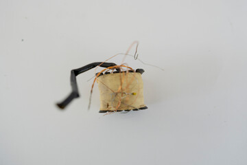 Disassembled Power Supply Transformer with Metal Parts and Wires