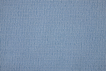 Textile close up of a light blue  fabric, fabric texture as a background.