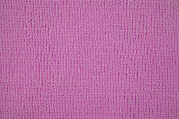 Textile close up of a pink fabric, fabric texture as a background.