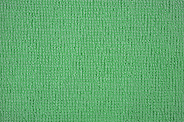 Textile close up of a green  fabric, fabric texture as a background.