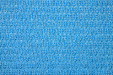 Textile close up of a light blue  fabric, fabric texture as a background.
