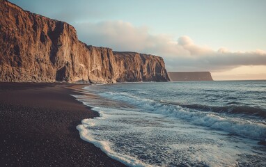 Coastal cliffs with waves gently rolling onto the shore