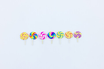 Sweet food lollipop on white background, Set of colorful lollipops isolated on white background, Colorful lollipops swirls, Spiral multicolor candy on white background, Top view