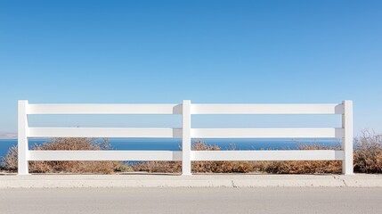 White fence overlooking ocean; scenic view; tranquil scene; outdoor backdrop; travel postcard